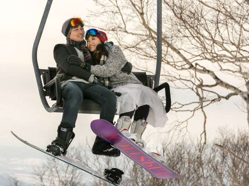 Chloe and Hongyi snowboarding for their pre wedding shoot
